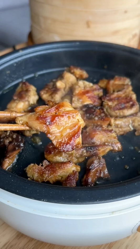 Glazed lion's mane piece held with chopsticks
