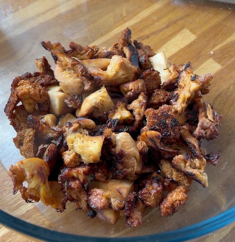 Bowl of crispy browned Popped Lion's Mane, close up
