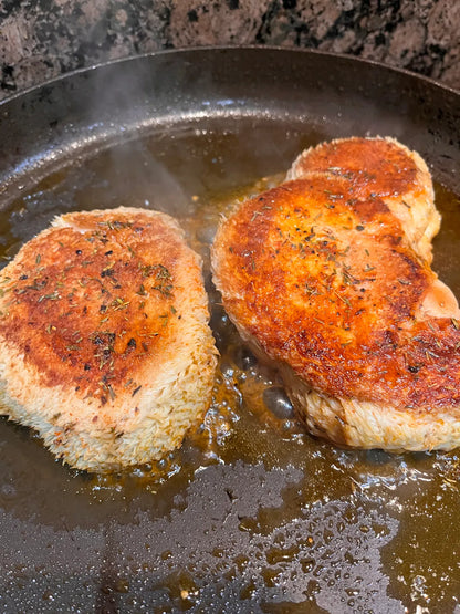 Lion's mane steaks searing in a pan